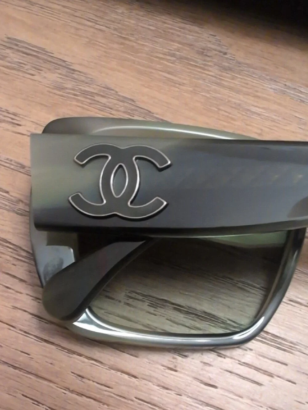 CHANEL sunglasses featuring